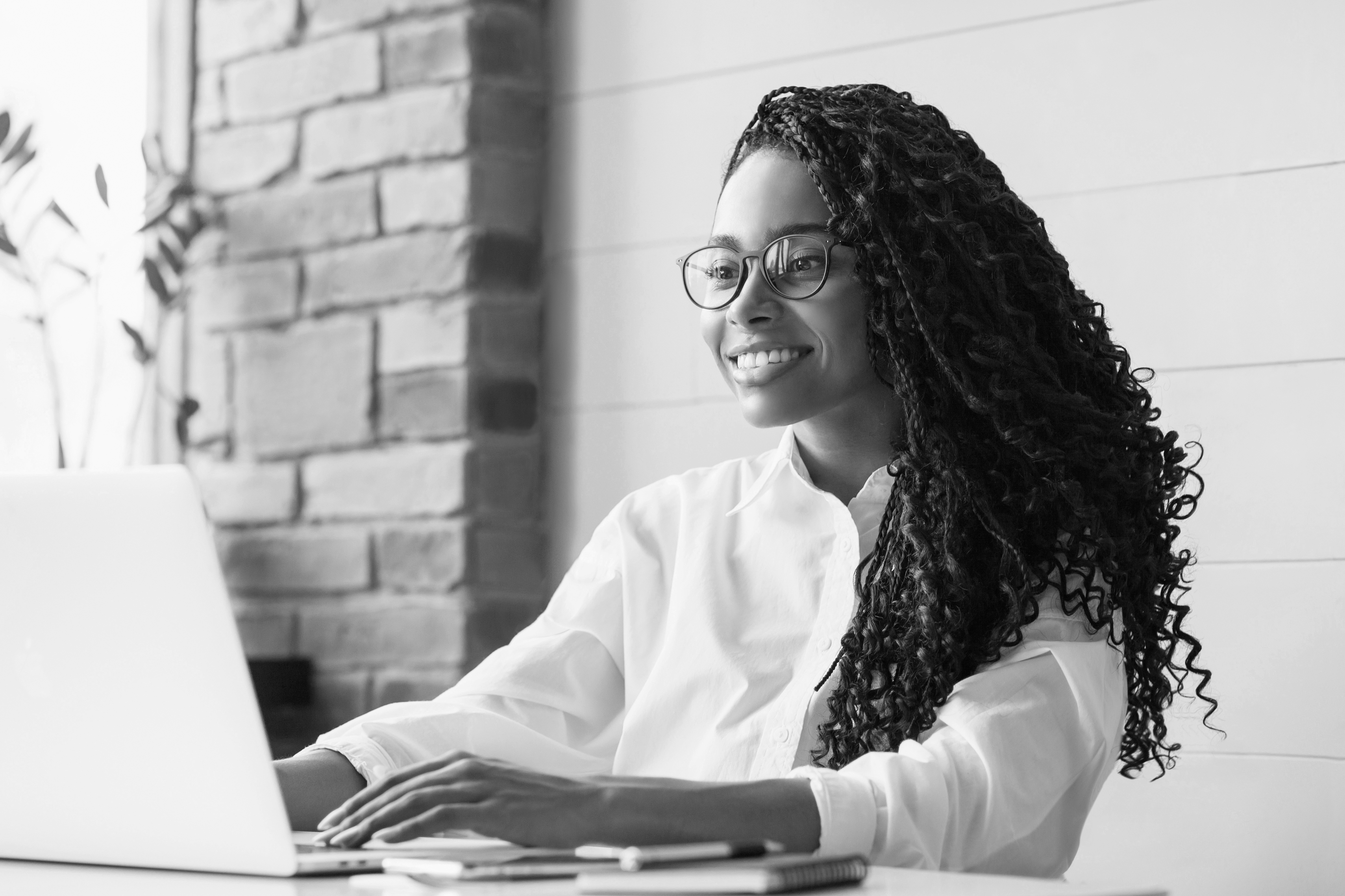 Smiling Black Women Working on Laptop